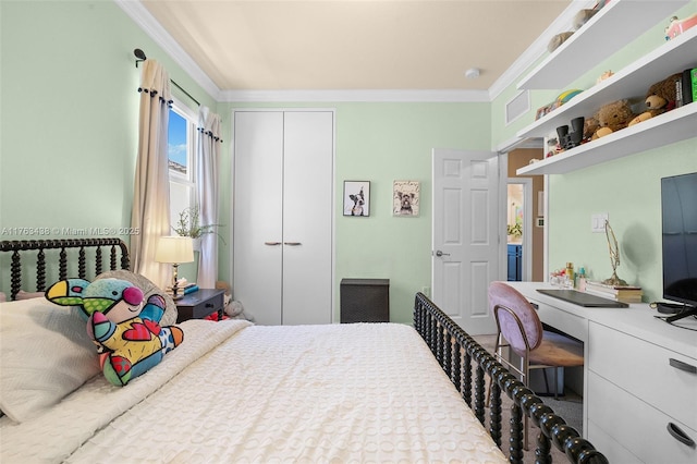 bedroom with a closet, visible vents, and ornamental molding