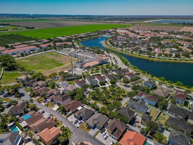 aerial view with a residential view and a water view