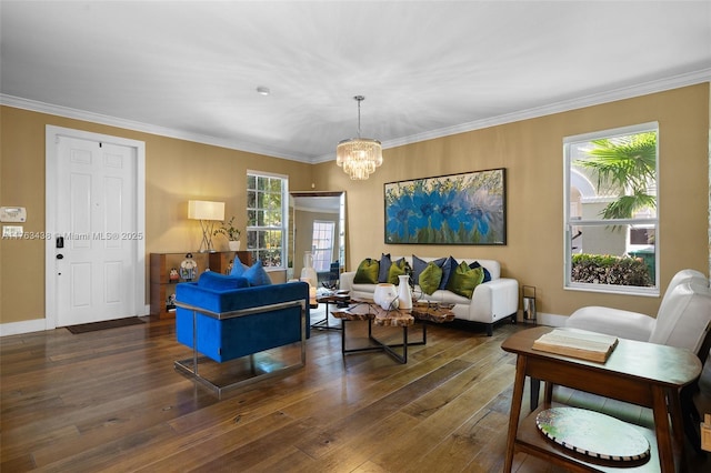 living room featuring an inviting chandelier, crown molding, and wood-type flooring