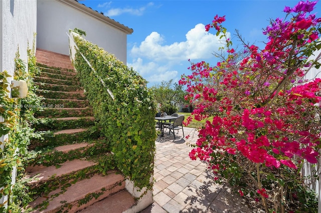 view of patio / terrace featuring stairway and outdoor dining area