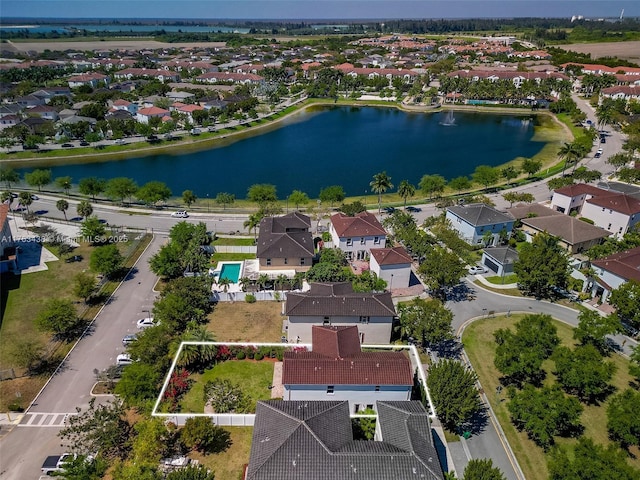 birds eye view of property featuring a residential view and a water view