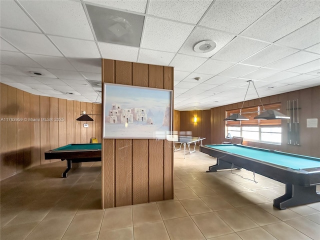 recreation room with pool table, wooden walls, and tile patterned flooring