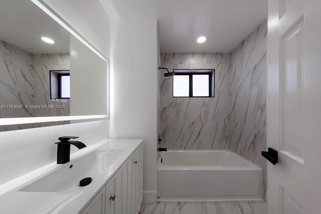 full bath featuring recessed lighting, shower / bathing tub combination, marble finish floor, and vanity