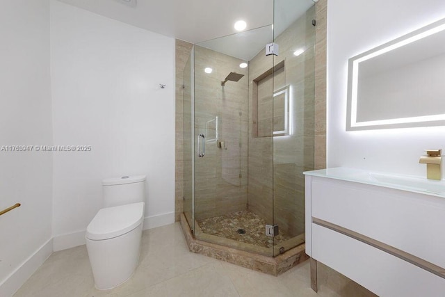 full bathroom with a shower stall, toilet, vanity, and baseboards