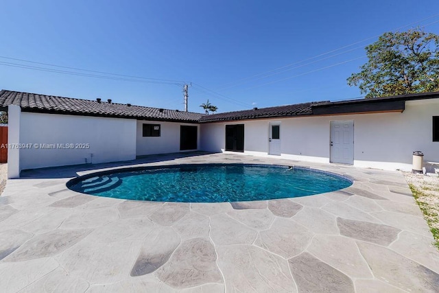 pool featuring a patio area