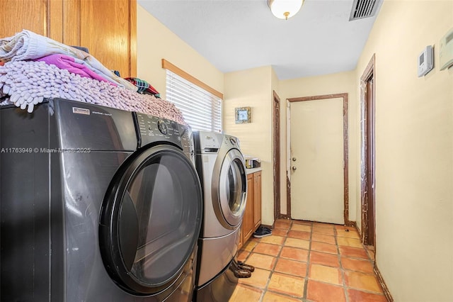 27425 SW 166th Ave, Homestead, FL 33031 - washroom featuring cabinet space, visible vents, independent washer and dryer, and light tile patterned floors
