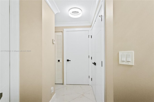 hallway with marble finish floor and crown molding