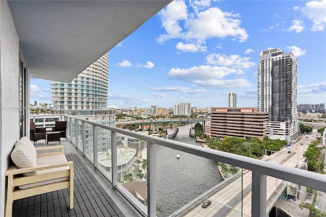 balcony with a city view and a water view