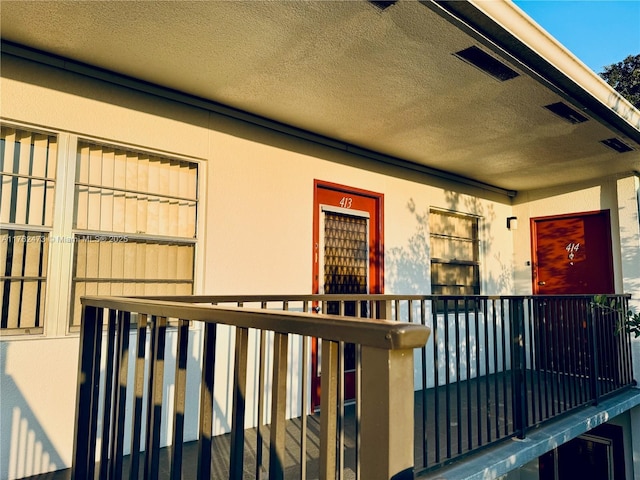 doorway to property with stucco siding