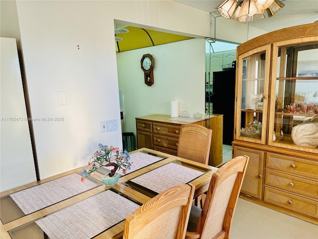 dining room featuring light tile patterned floors