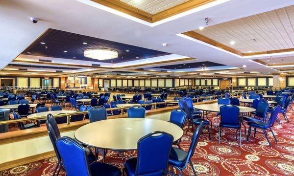 dining area with a raised ceiling