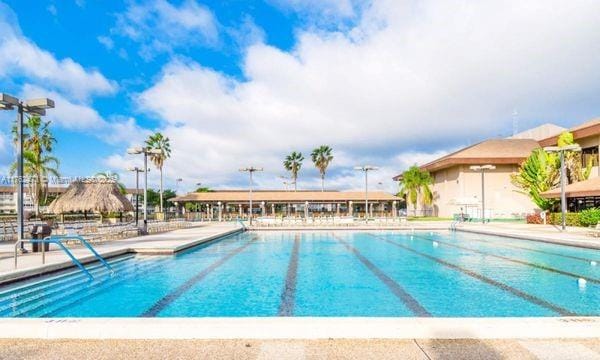 community pool featuring a patio area