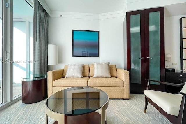 living area featuring carpet flooring and plenty of natural light