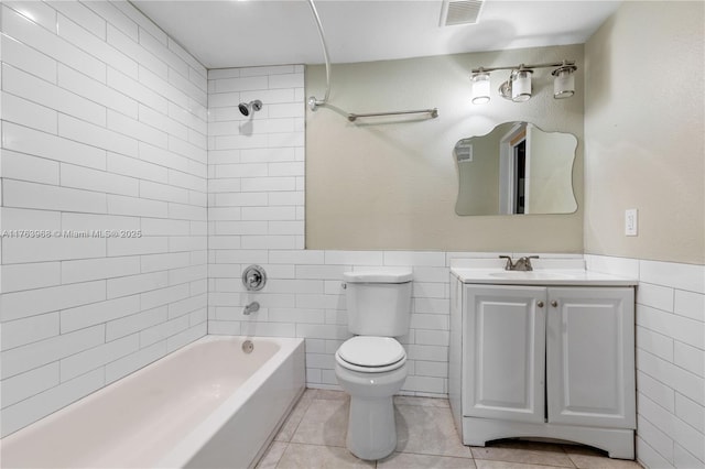 bathroom with tile patterned flooring, tile walls, toilet, and visible vents