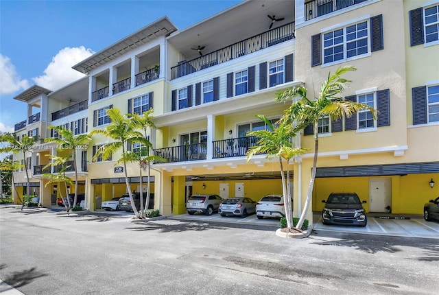 view of property featuring covered parking