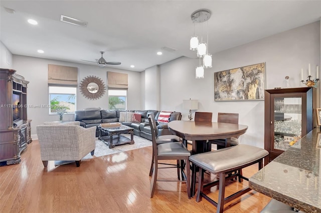 dining room with recessed lighting, a ceiling fan, visible vents, and light wood-type flooring