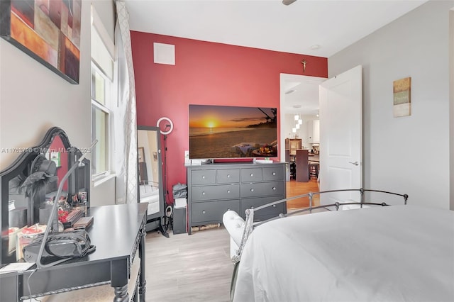 bedroom featuring visible vents and light wood finished floors