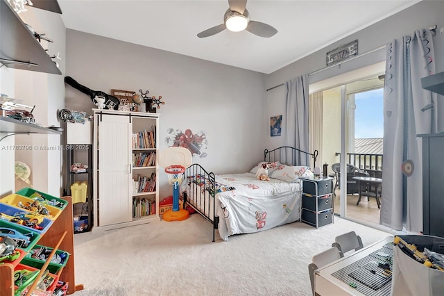 carpeted bedroom featuring a ceiling fan and access to outside