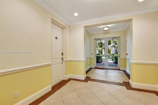 entryway with tile patterned floors, recessed lighting, crown molding, and baseboards