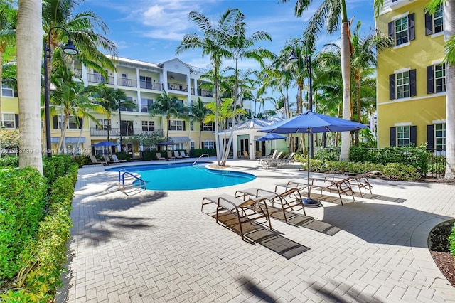 community pool featuring a patio area