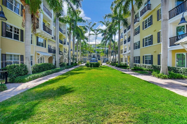 view of home's community with a yard