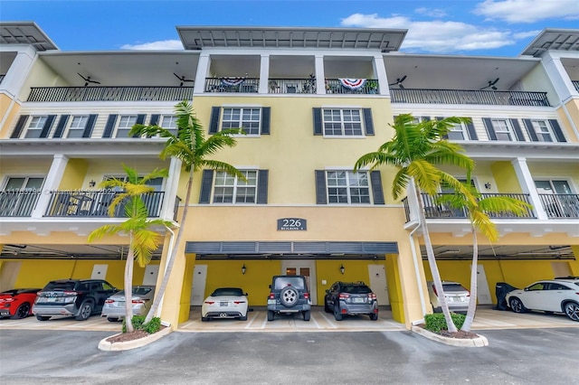 view of building exterior featuring covered parking