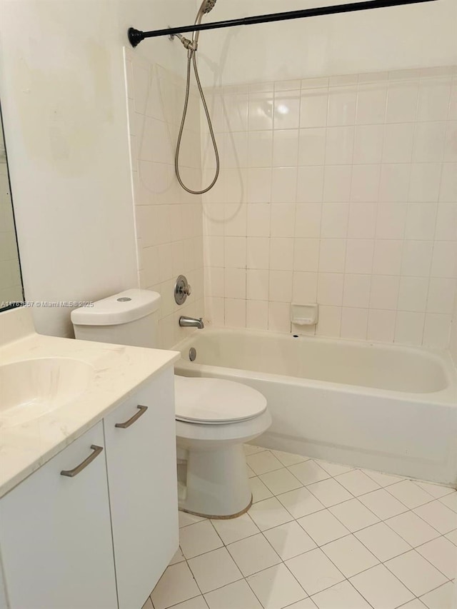 bathroom with vanity, toilet, bathtub / shower combination, and tile patterned flooring