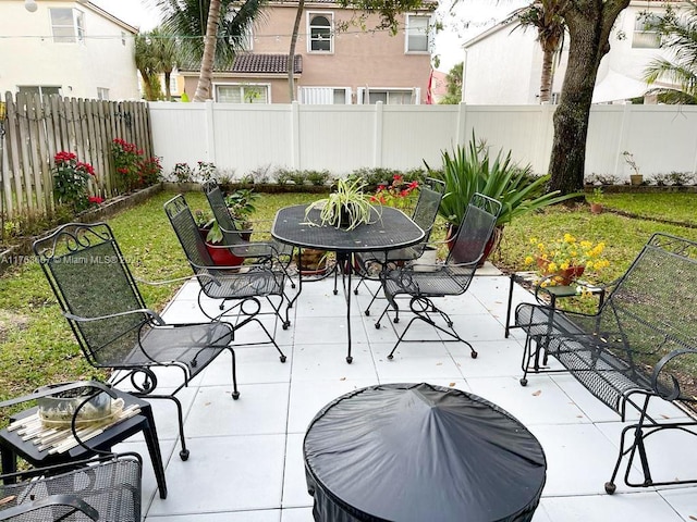 view of patio / terrace featuring outdoor dining space and a fenced backyard