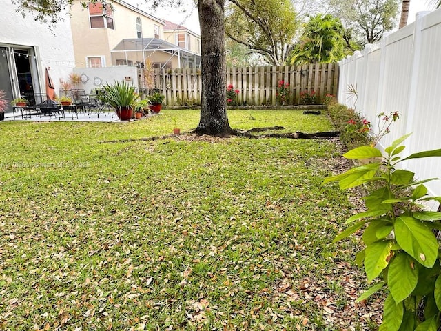 view of yard featuring a patio and fence