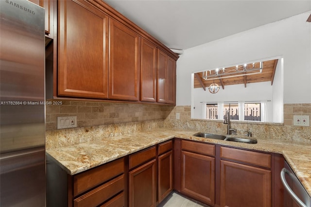 kitchen featuring beamed ceiling, dishwasher, light stone counters, decorative backsplash, and a sink