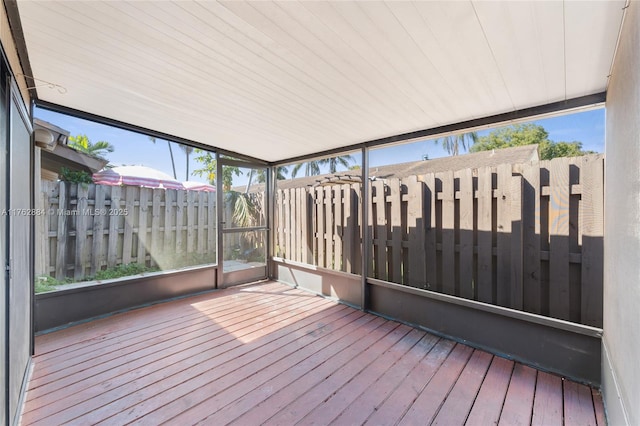 unfurnished sunroom featuring a wealth of natural light