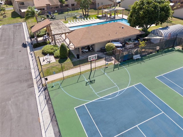 view of sport court featuring community basketball court and fence