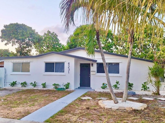 view of front of home featuring stucco siding