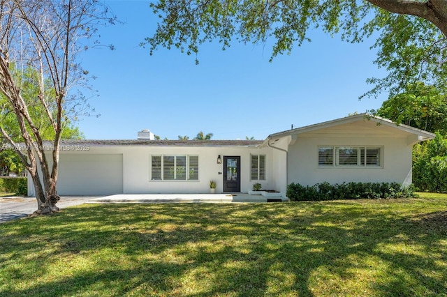 ranch-style home featuring a front lawn, a garage, and stucco siding