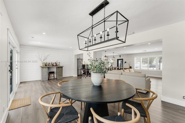 dining space featuring recessed lighting, visible vents, baseboards, and wood finished floors