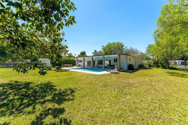 view of yard featuring a patio area, fence private yard, and a fenced in pool