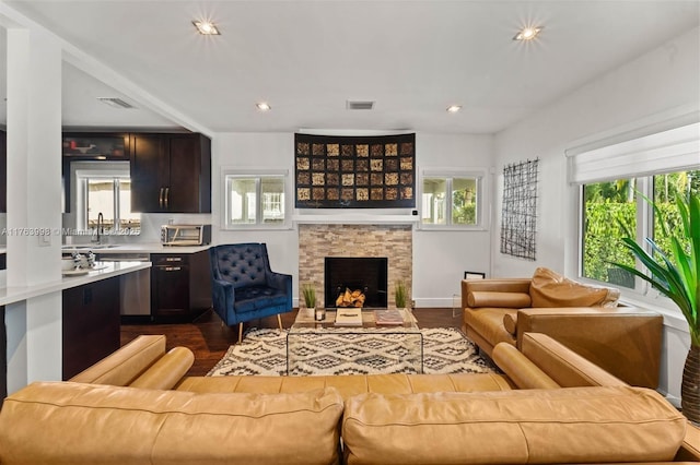 living room with visible vents and plenty of natural light