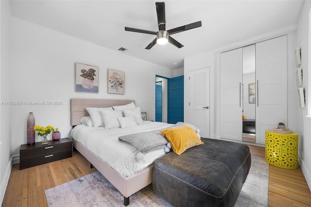 bedroom with a ceiling fan and wood finished floors