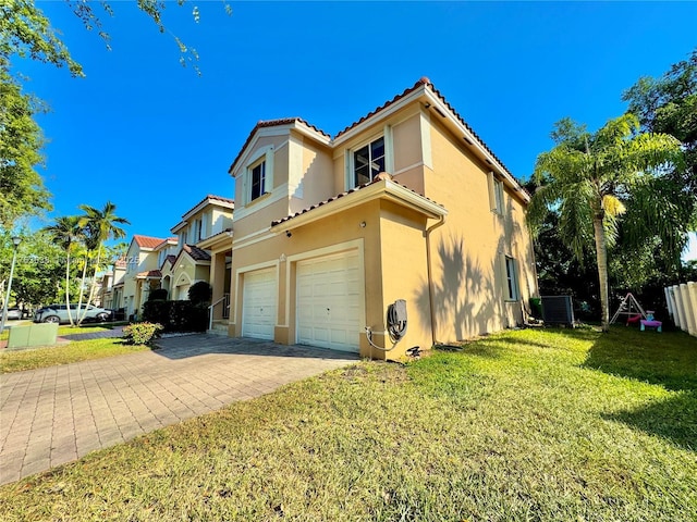 view of home's exterior with central AC unit, stucco siding, a lawn, decorative driveway, and a garage