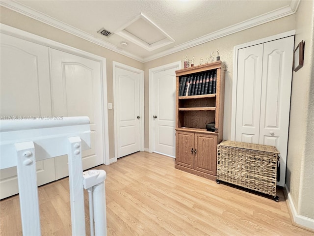 17130 SW 36th Ct Unit 17130, Miramar, FL 33027 - unfurnished office featuring light wood-type flooring, visible vents, attic access, and crown molding
