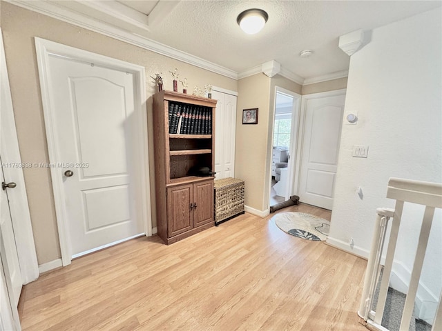 17130 SW 36th Ct Unit 17130, Miramar, FL 33027 - interior space with light wood-type flooring, baseboards, a textured ceiling, and crown molding