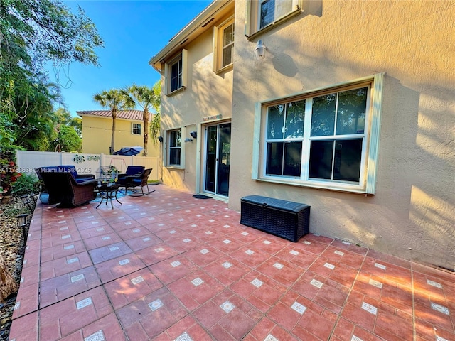 view of patio featuring fence