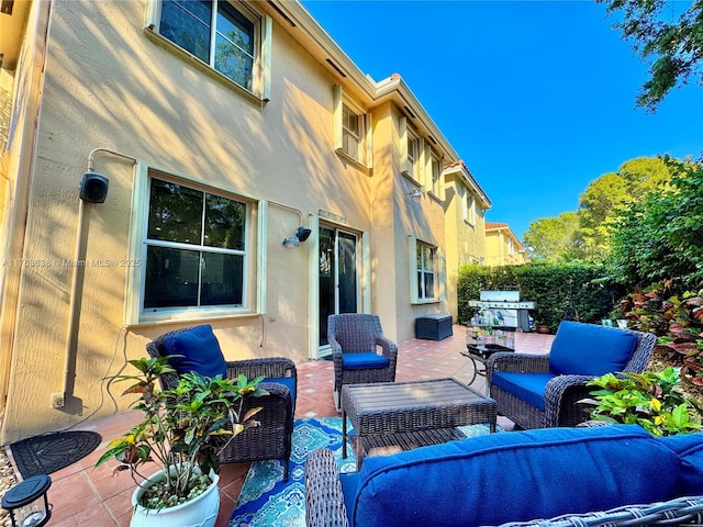 view of patio / terrace featuring outdoor lounge area and a grill