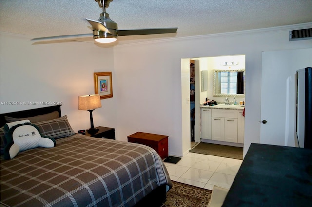 bedroom with visible vents, ornamental molding, a sink, a textured ceiling, and marble finish floor