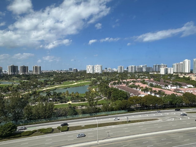 birds eye view of property featuring a view of city and a water view