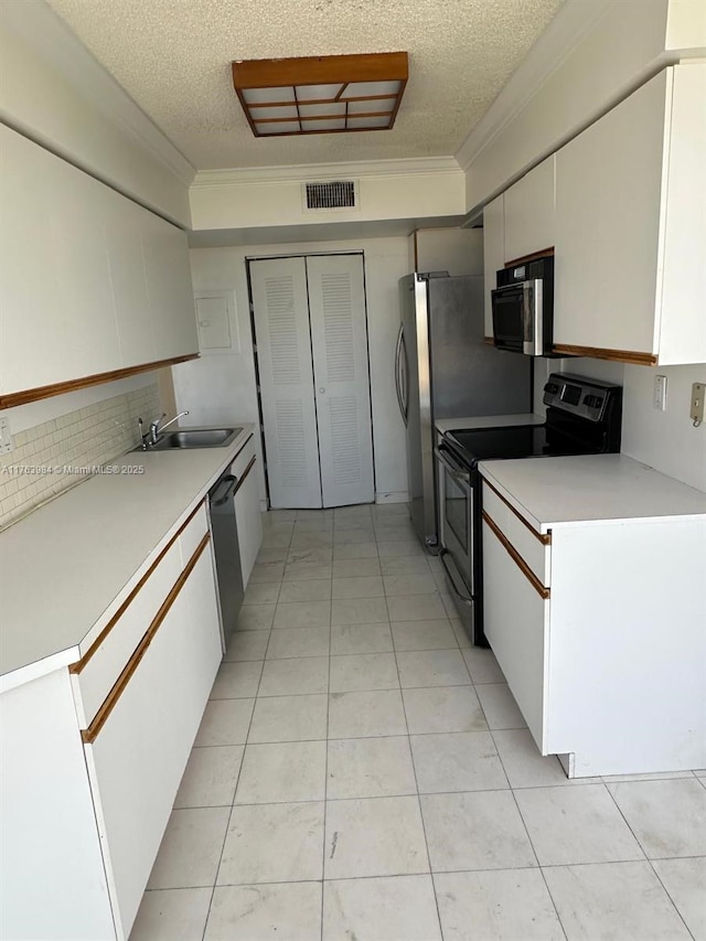 kitchen featuring visible vents, dishwasher, white cabinets, and stainless steel range with electric cooktop