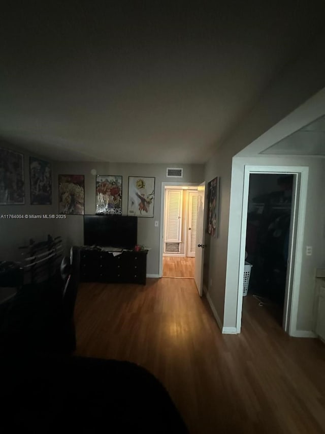 2101 NE 68th St Unit 204, Fort Lauderdale, FL 33308 - living area featuring visible vents, baseboards, and wood finished floors