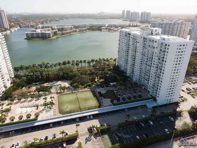 drone / aerial view featuring a view of city and a water view