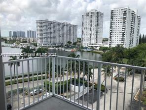 balcony with a view of city and a water view