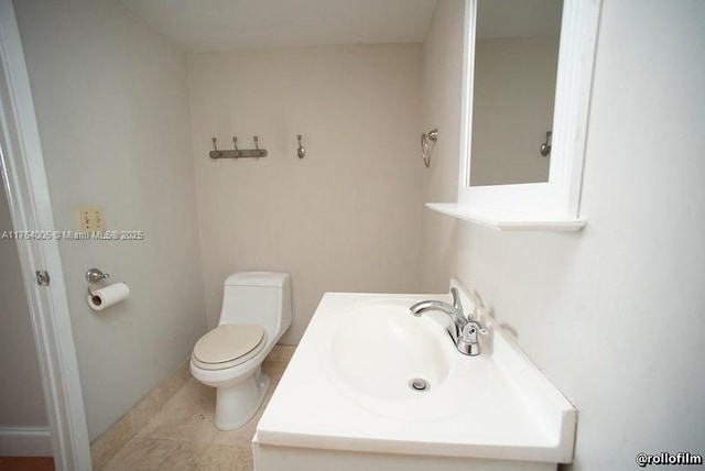 bathroom featuring toilet and a sink